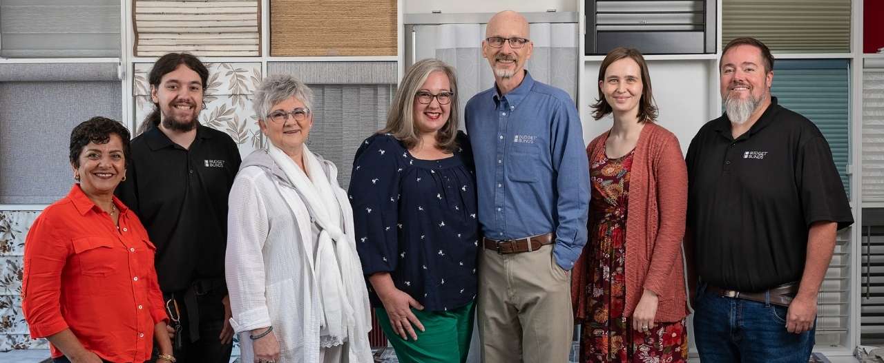 Jackie, Pattie, Kirsten, Gary, Samantha and Jordan standing in the showroom